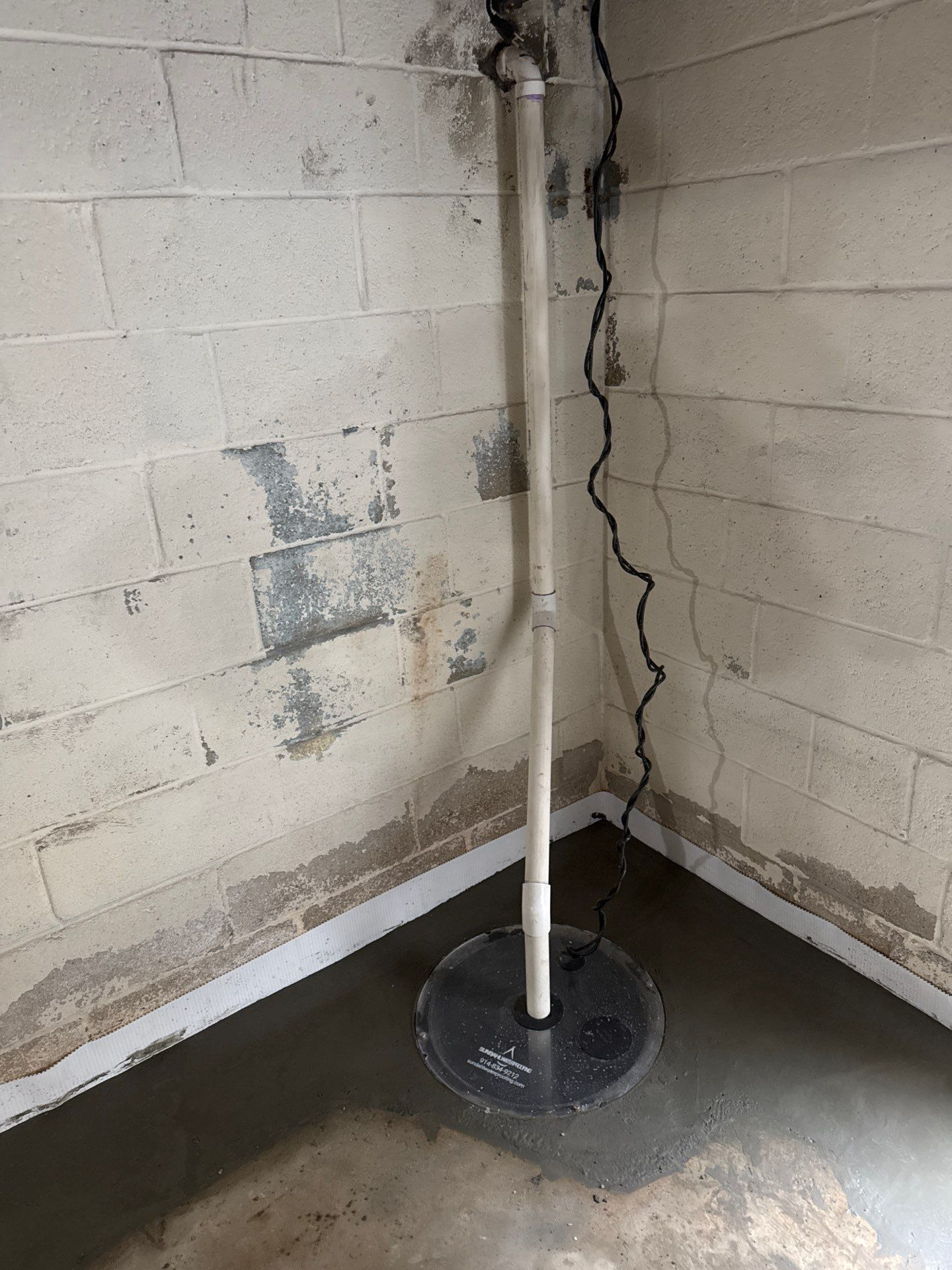 Sump pump installed in basement with interior drain tile system in Hastings-On-Hudson NY